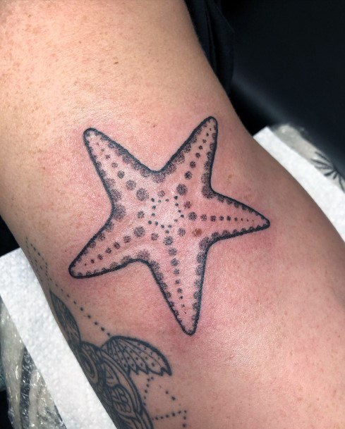 Ravishing Starfish Tattoo On Female