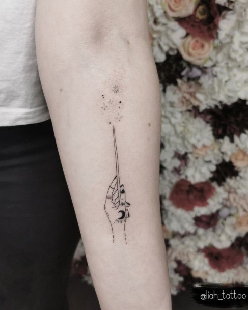 Ravishing Wand Tattoo On Female