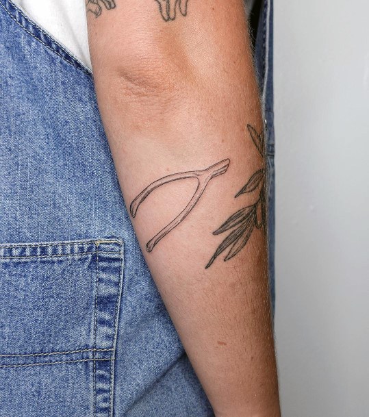 Ravishing Wishbone Tattoo On Female