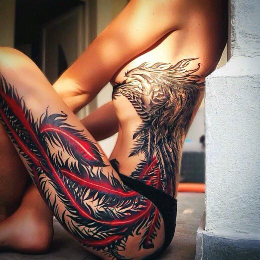 Red Feathers And Mammoth Wolf Tattoo