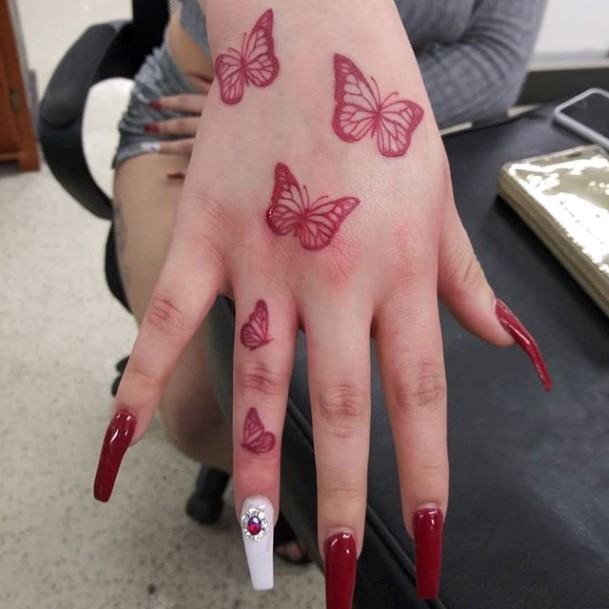 Red Fluttering Butterflies Womens Finger Tattoo