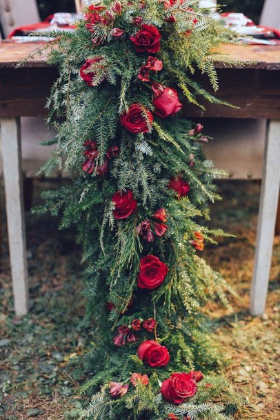 Red Roses And Greens Christmas Wedding Flowers