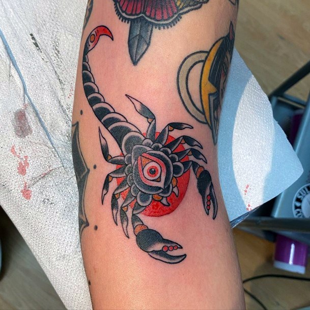 Red Toned Scorpion Tattoo Womens Arms