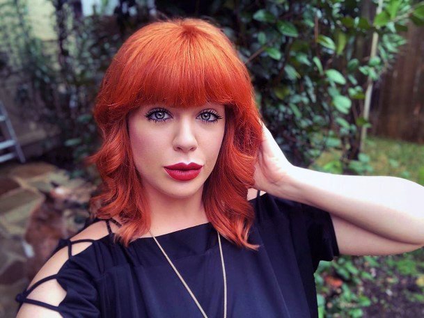 Red Wavy Medium Length Hairstyles With Fringe For Girls And Women