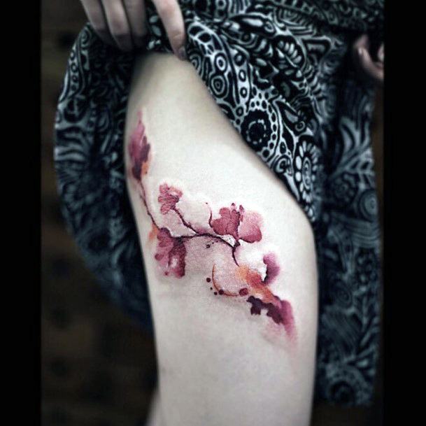 Reddish Flower Tattoo Womens Legs