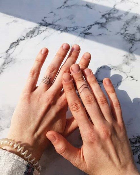 Rising Sun Tattoo Womens Fingers