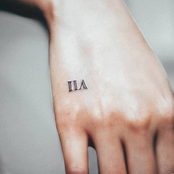 Roman Numeral Female Tattoo Designs