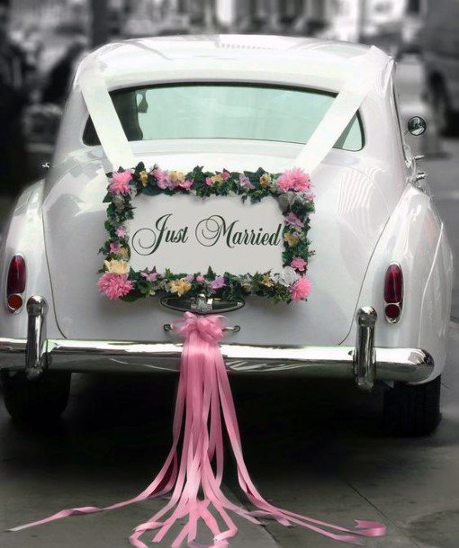 Romantic Pink Decoration On White Wedding Car