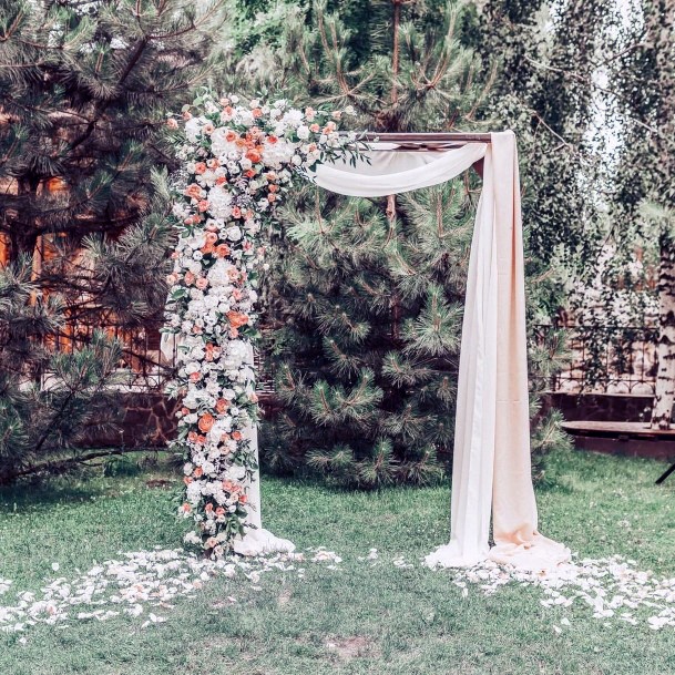 Rustic Romantic Outdoor Cascading Greenery And Florals With Cream Drapery Wedding Arch Ideas