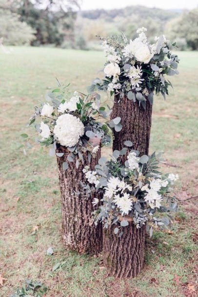 Rustic Wedding Flowers On Wooden Logs