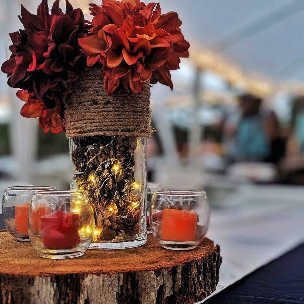 Rusty Orange And Burgudny Centerpieces On Wood Slab Rustic Fall Wedding Ideas