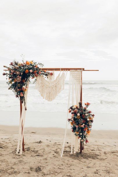 Sandy Beach Wedding Arch With Boho Flowers