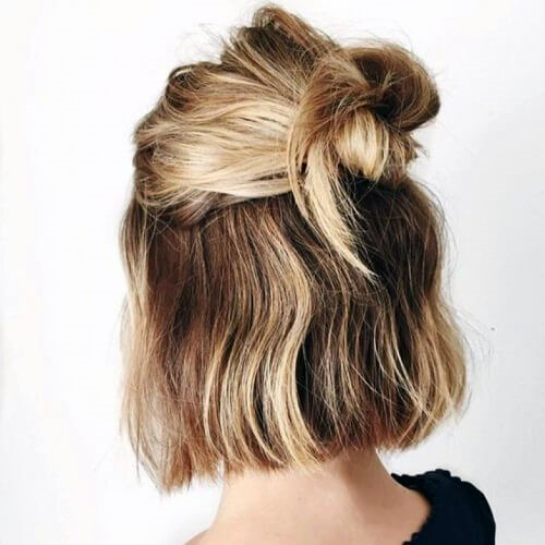 Sandy Blonde Chin Length Hair Pulled Back Into Hair Knot