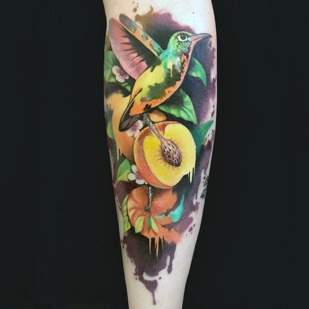 Seeded Fruit And Hummingbird Tattoo For Women