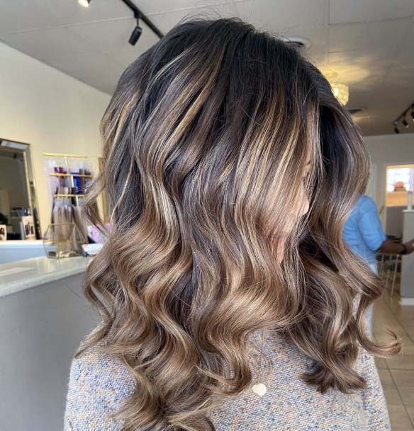 Sexy And Polished Dark Brown And Caramel Highlighted Womens Hairstyle