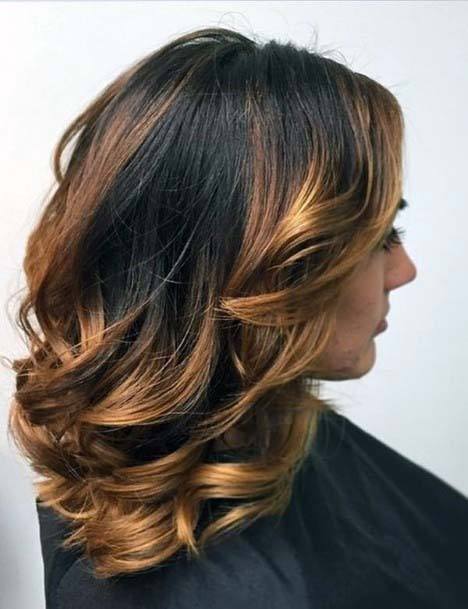 Shiny Hair On Female With Black Hair And Golden Brown Highlighted Layered In