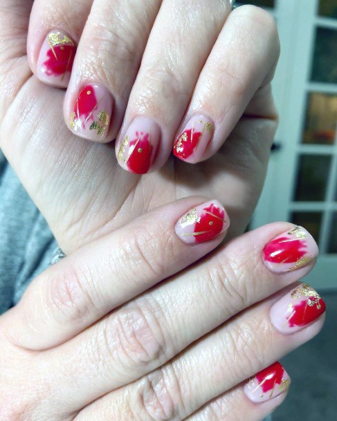 Short Red And Gold Splattered Nails For Women
