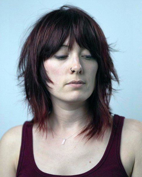 Shoulder Length Deep Red Hair Color Face Framing Bangs And Razor Shag