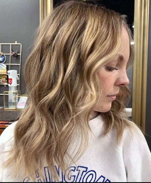 Shoulder Length Hair On Woman Sandy Blonde Layered Hair