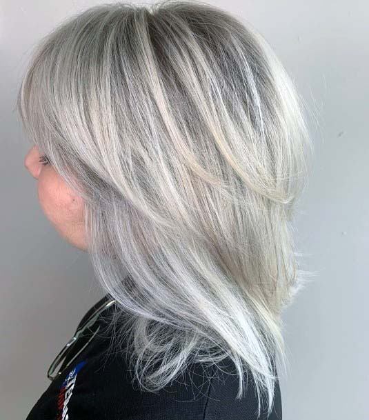 Shoulder Length Icy Grey Hair On Woman Feather Layered