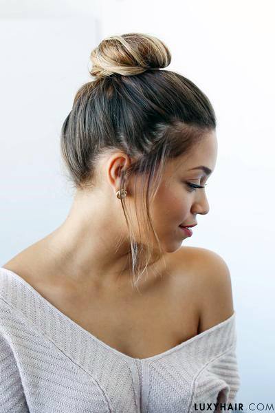 Side View Of Cute Woman With Loosely Top Knot Hairstyle