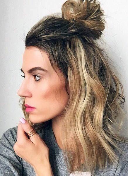 Side View Of Woman With A Medium Top Knot Hairstyle