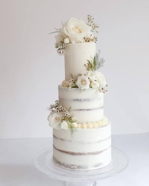 Silver Bands On Beautiful White Wedding Cake With Roses