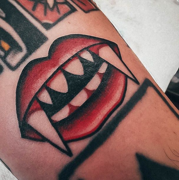 Simple Fangs Tattoo For Women