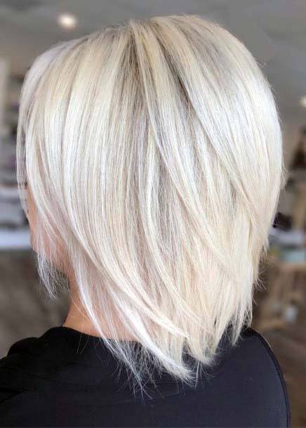 Simple Soft Rooted Platinum Blonde Sleek Layered Bob Womens Hairstyle