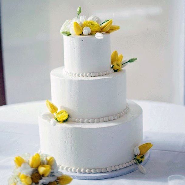 Simple Yellow Flowers On White Cake