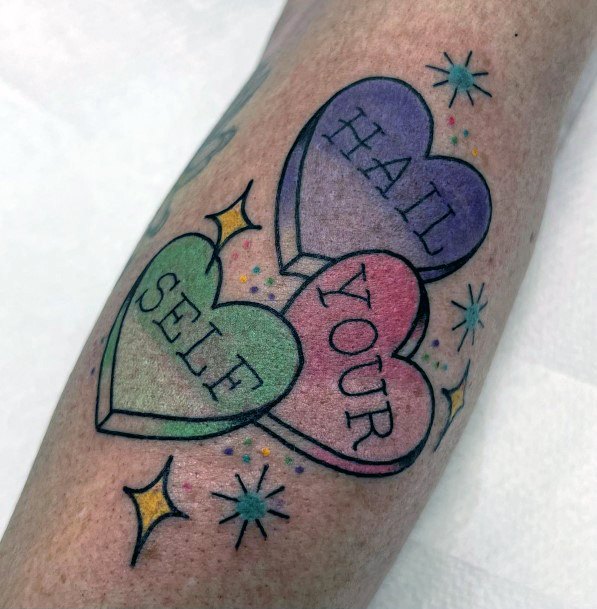 Simplistic Candy Heart Tattoo For Girls