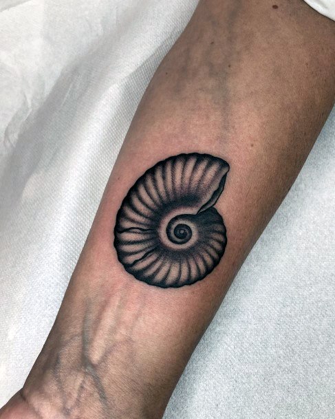 Simplistic Nautilus Tattoo For Girls