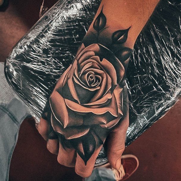 Simplistic Rose Hand Tattoo For Girls