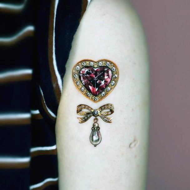 Simplistic Ruby Tattoo For Girls