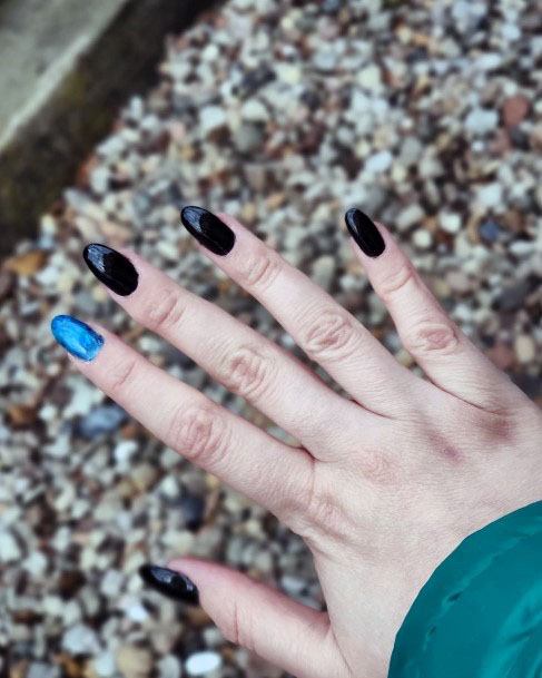 Sleek Almond Polished Blue And Black Nail Design Inspiration For Women