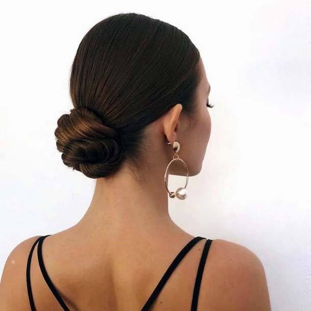 Sleek And Polished Tight Dark Brown Bun Updo Womens Hairstyle