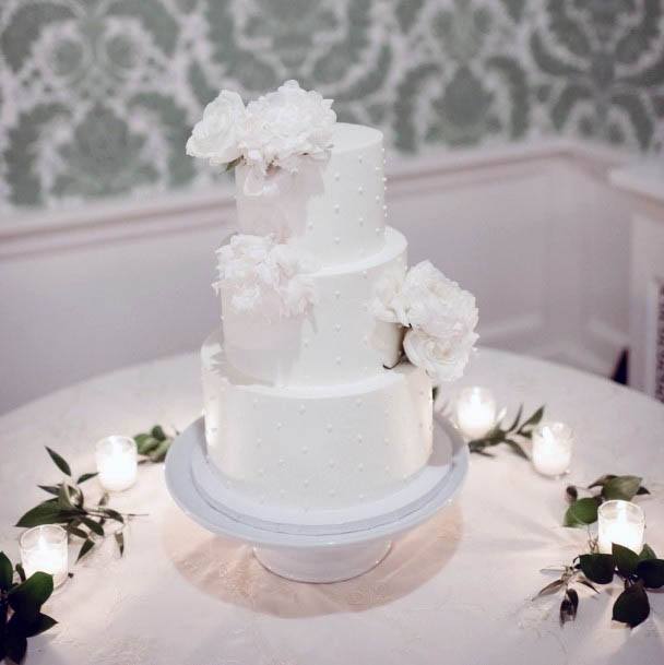 Sleek White Wedding Cake Lush Flower Desert Table Ideas