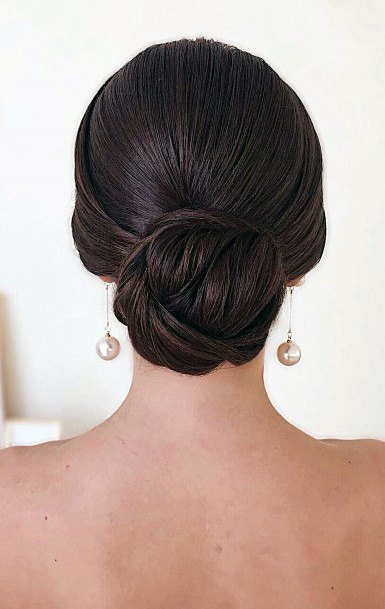 Smooth Straight Hair With Low Bun On Female