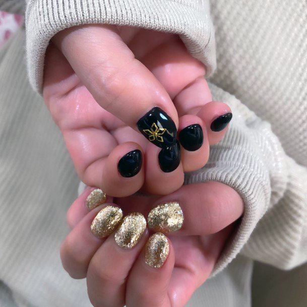 Sparkly Gold And Black Colored Nails