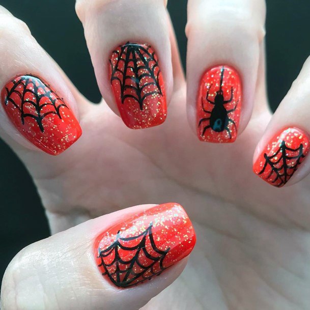 Sparkly Orange And Spooky Black Spiderweb Nail Design For Ladies