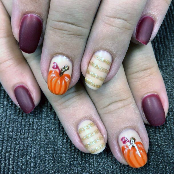 Striped Golden Glitters And Pumpkin Nails For Women