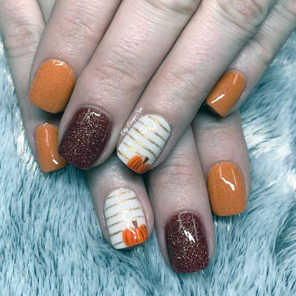 Striped Golden Pumpkin And Shiny Wine Nails For Women