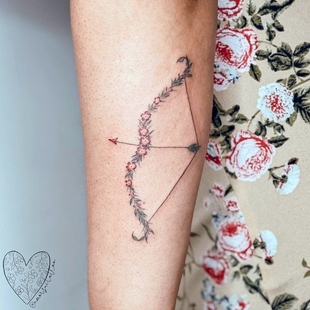 Stunning Bow And Arrow Tattoo On Lady