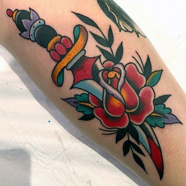 Stunning Dagger Rose Tattoo On Lady