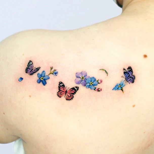 Stunning Flower Petal Tattoo On Lady