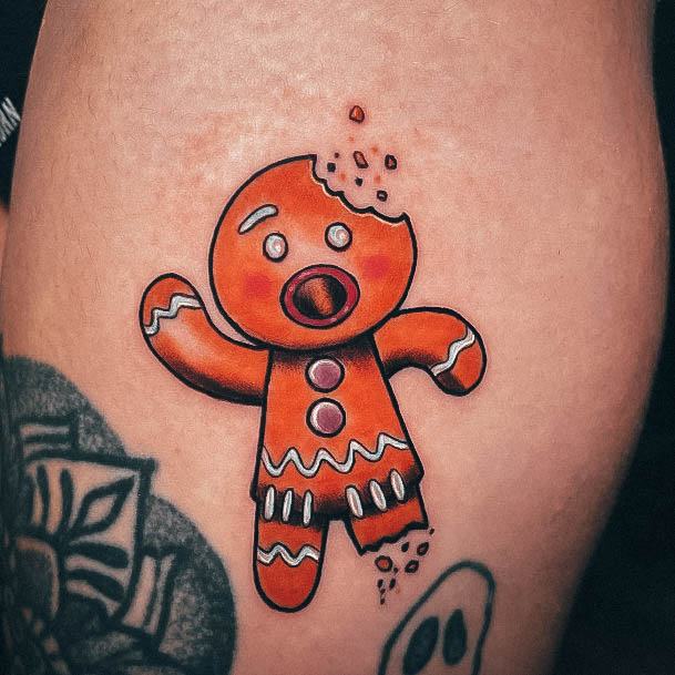 Stunning Gingerbread Man Tattoo On Lady