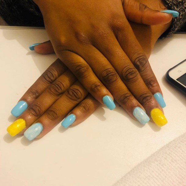 Stunning Girls Blue And Yellow Nails