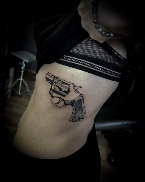 Stunning Girls Gun Tattoos