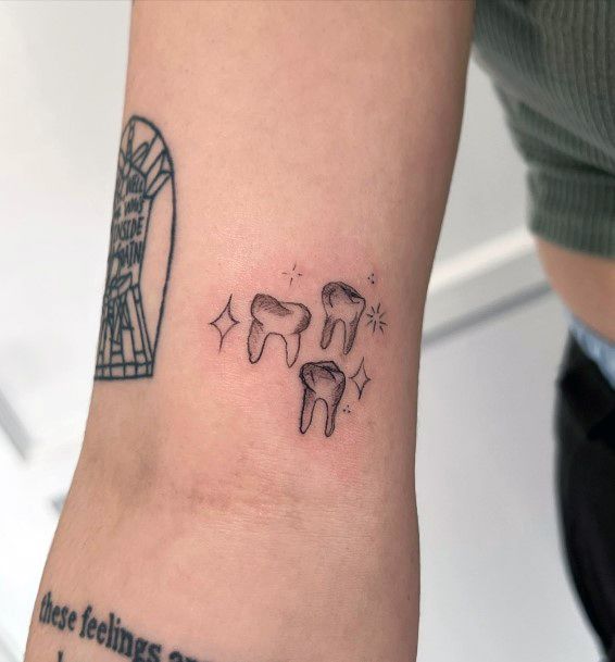 Stunning Girls Tooth Tattoos