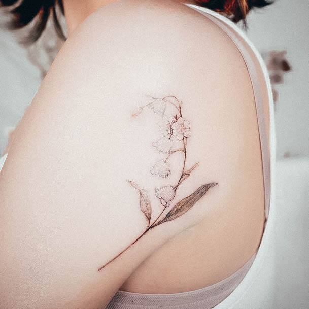 Stunning Lily Of The Valley Tattoo On Lady